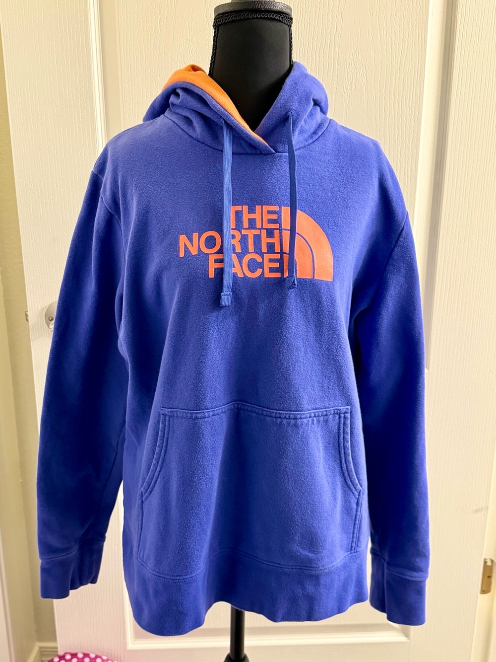 The North Face Women’s Blue Hoodie with Orange Logo